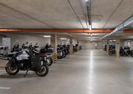 Motorcycle parked in the hotel garage of EFI SPA Hotel in Brno